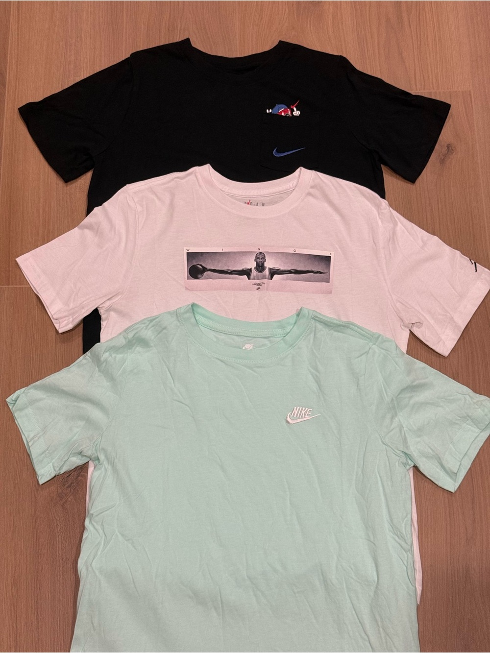 Bundled T-Shirts. 1 Jordan and 2 Nike. Black, white, and mint. Cotton fabric